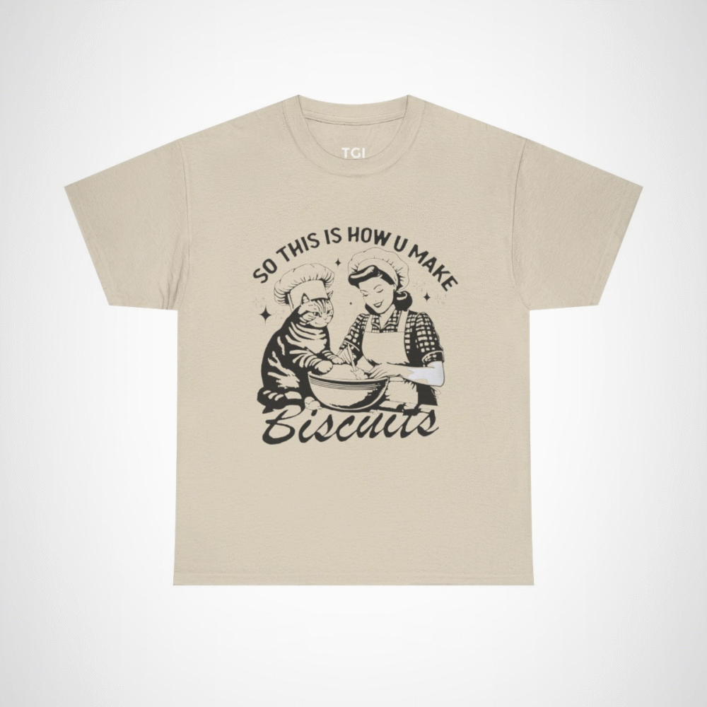 Humorous t-shirt featuring a cat and a baker with the phrase 'So This Is How You Make Biscuits' Sand colour