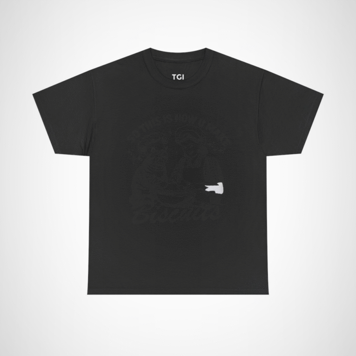 Humorous t-shirt featuring a cat and a baker with the phrase 'So This Is How You Make Biscuits' Black colour